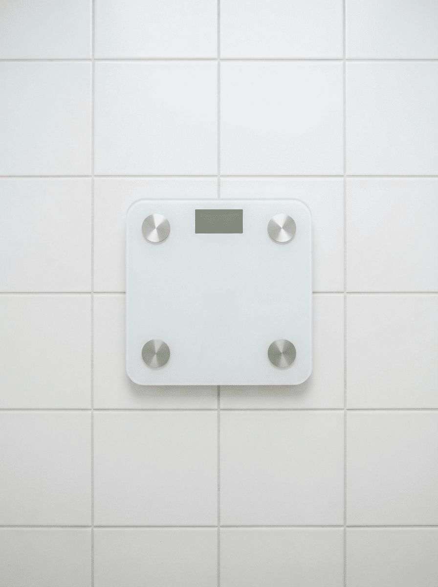 modern digital bathroom scale on white tiles