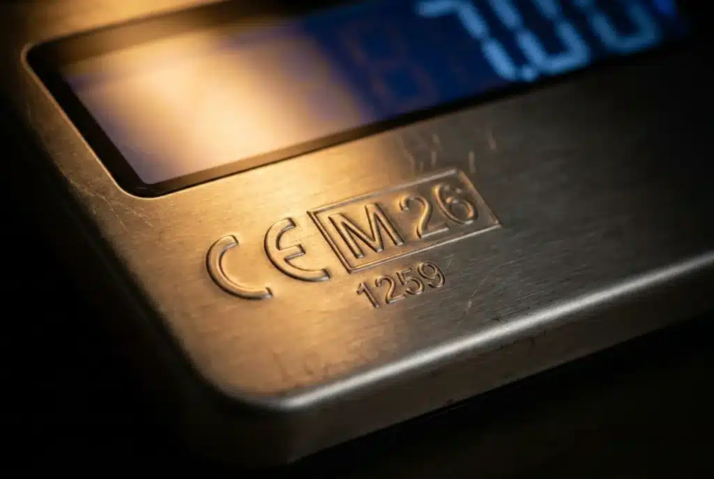 EU Weighing Scale Regulations: A close-up of a European retail scale's data plate showing the CE mark, M mark, and notified body number